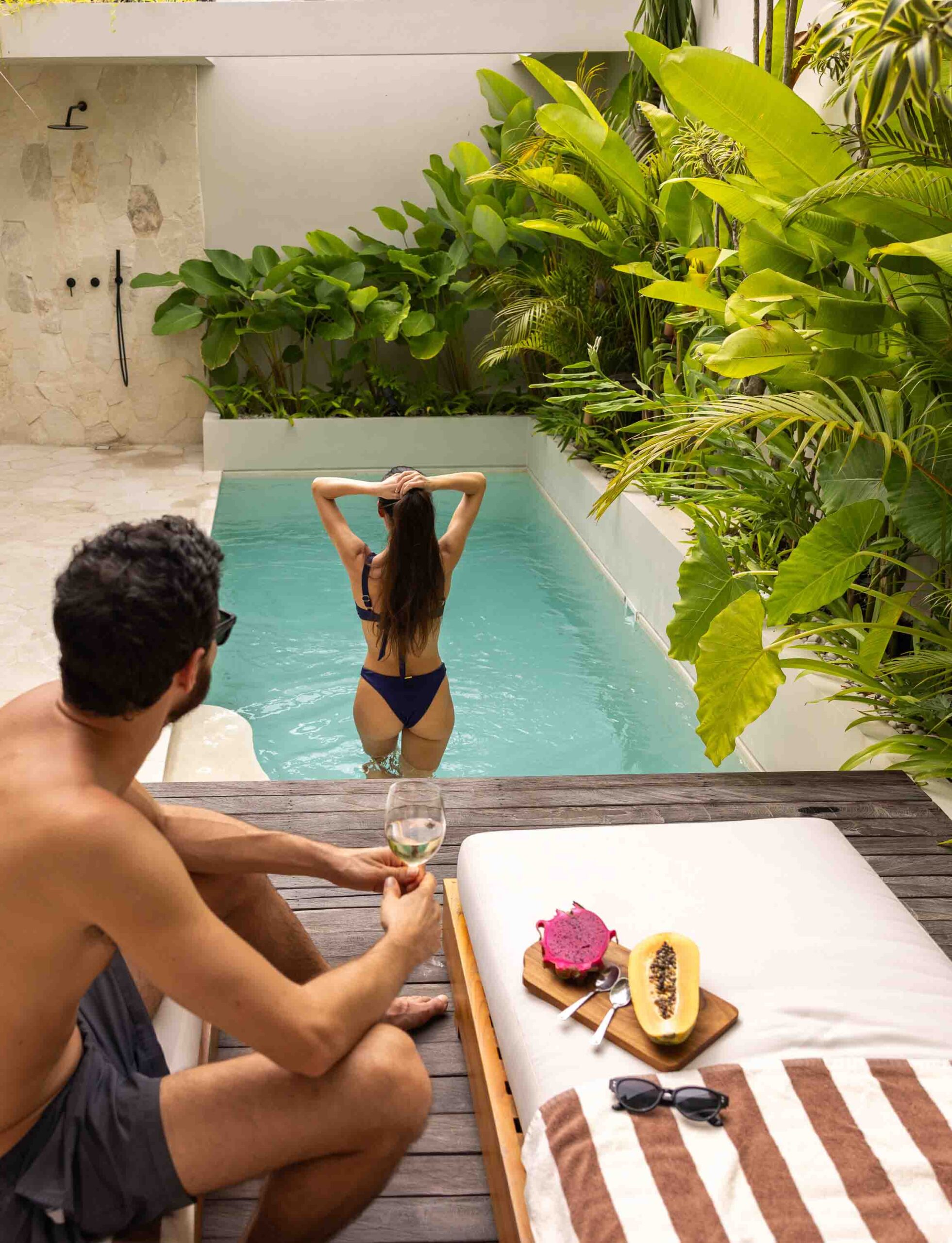 couple in pool at a luxury villla